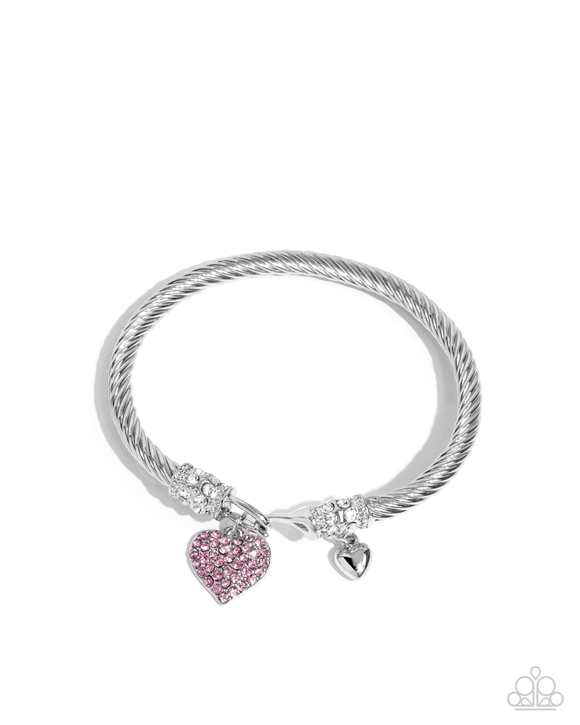 Heart Hour - Pink

P9RE-PKXX-337XX
Rippling with wavy textures, a glistening band of silver coils and twists along the wrist for a timeless display. A light rose rhinestone-encrusted silver heart swings from one end of the display while a dainty, solitair